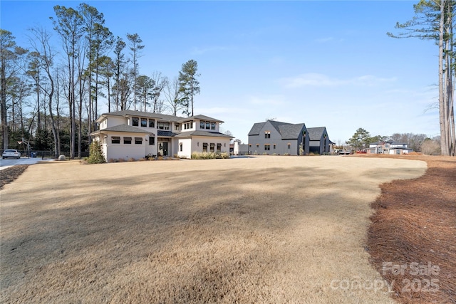 view of front facade featuring a front lawn and a garage