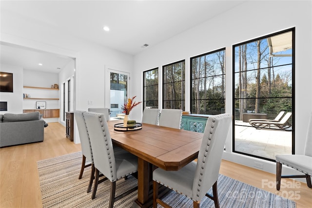 dining room with light hardwood / wood-style flooring