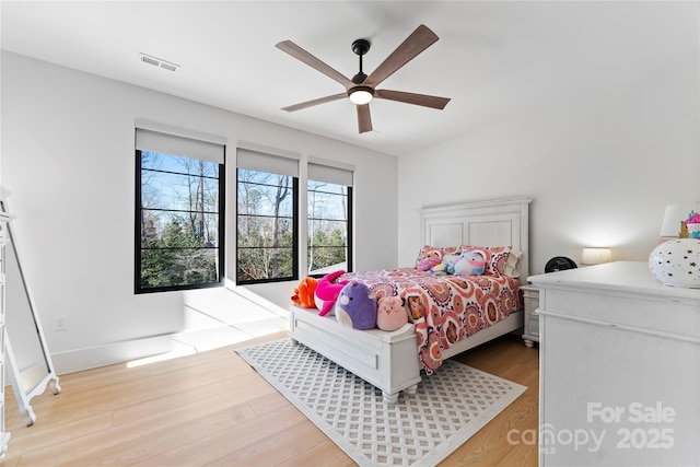 bedroom featuring light wood-type flooring and ceiling fan