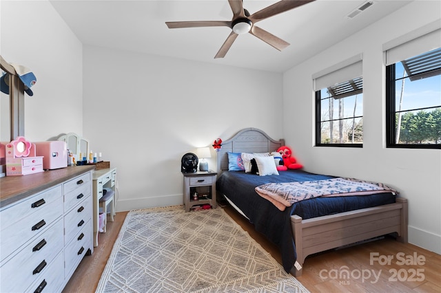 bedroom with light wood-type flooring and ceiling fan