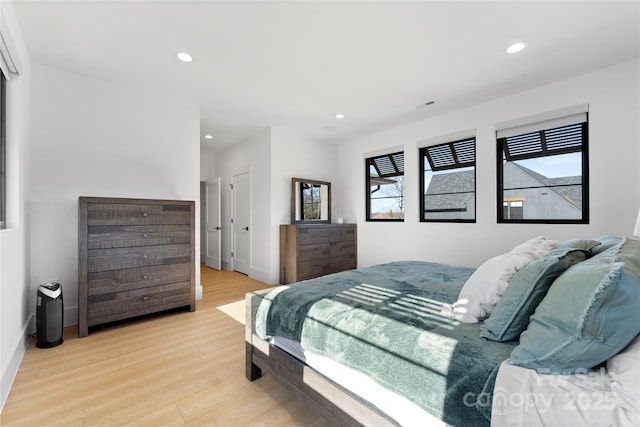 bedroom with light wood-type flooring