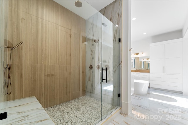 bathroom featuring vanity and separate shower and tub