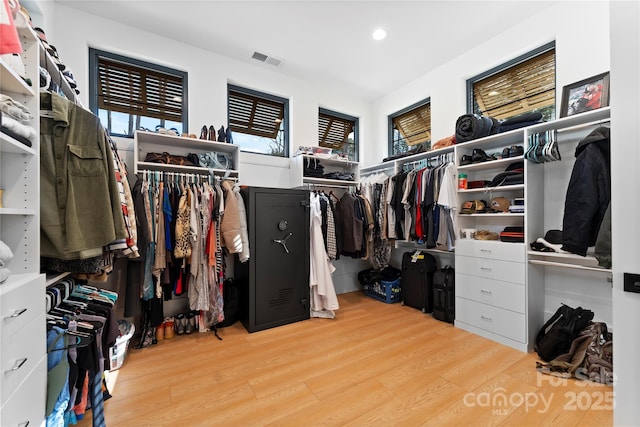 walk in closet featuring light hardwood / wood-style floors