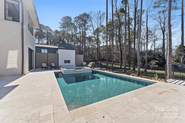 view of swimming pool featuring an outdoor fireplace, a hot tub, and a patio area