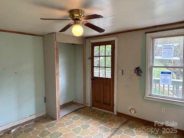 entryway featuring ceiling fan and a healthy amount of sunlight