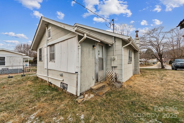 view of property exterior featuring a yard