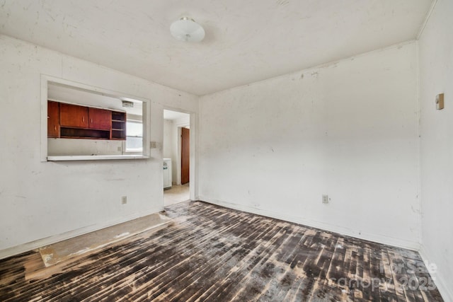 empty room with dark hardwood / wood-style floors