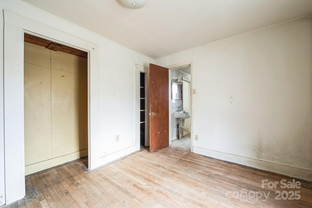 unfurnished bedroom with light hardwood / wood-style flooring