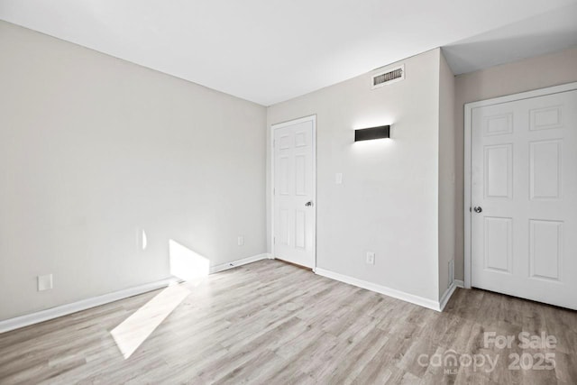 unfurnished bedroom featuring light hardwood / wood-style floors