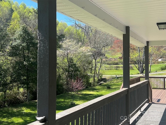 deck featuring a yard