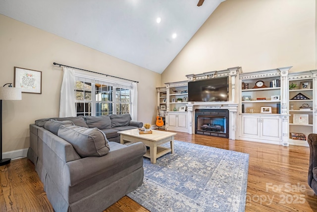 living room featuring light hardwood / wood-style floors and lofted ceiling