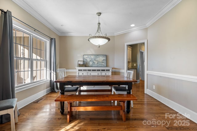 dining room featuring crown molding and wood-type flooring