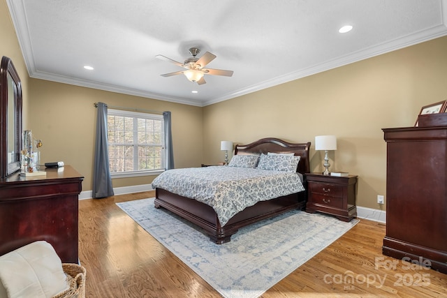 bedroom featuring ornamental molding, ceiling fan, and hardwood / wood-style floors