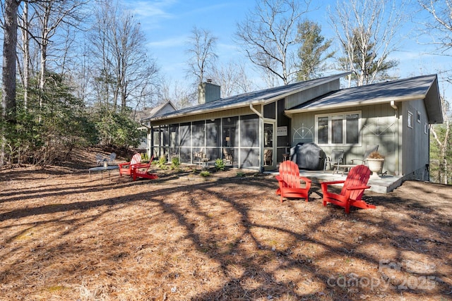 back of property featuring a sunroom