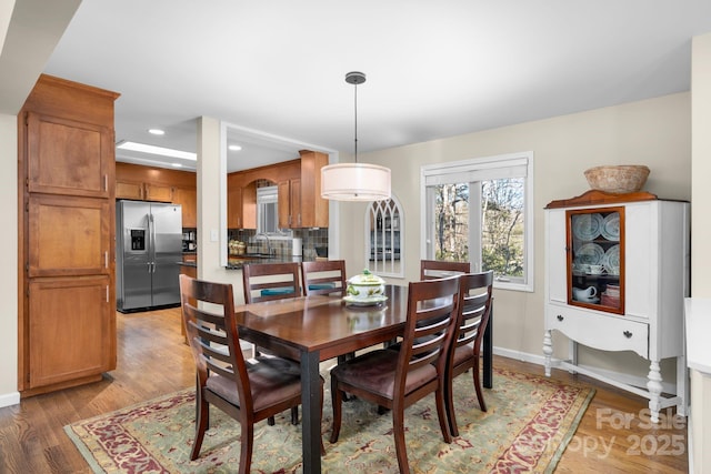 dining space featuring hardwood / wood-style floors