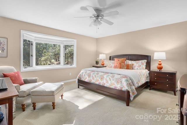 bedroom featuring ceiling fan and light colored carpet