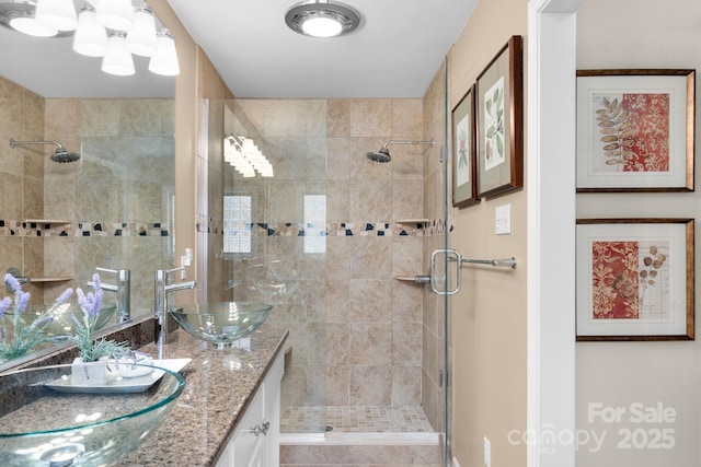 bathroom with vanity and walk in shower