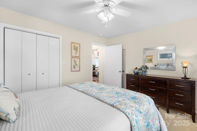 bedroom featuring ceiling fan and a closet