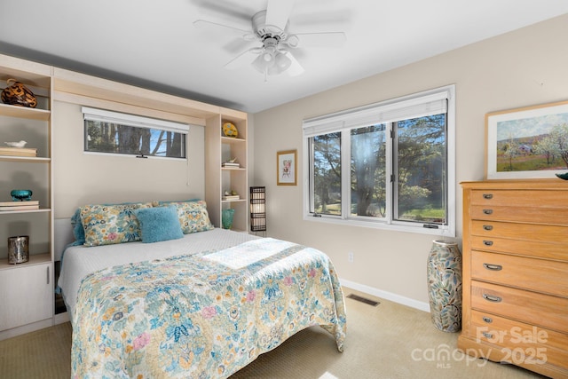 carpeted bedroom with ceiling fan