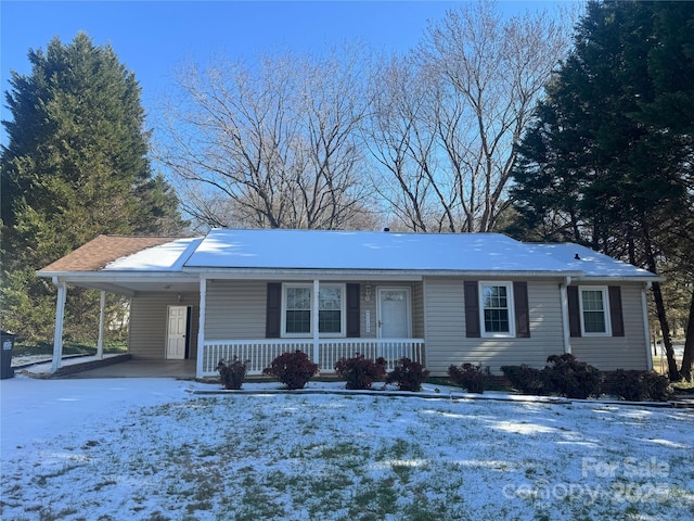 ranch-style house with a carport and a porch