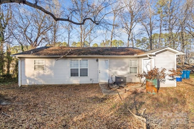 back of house featuring central AC unit