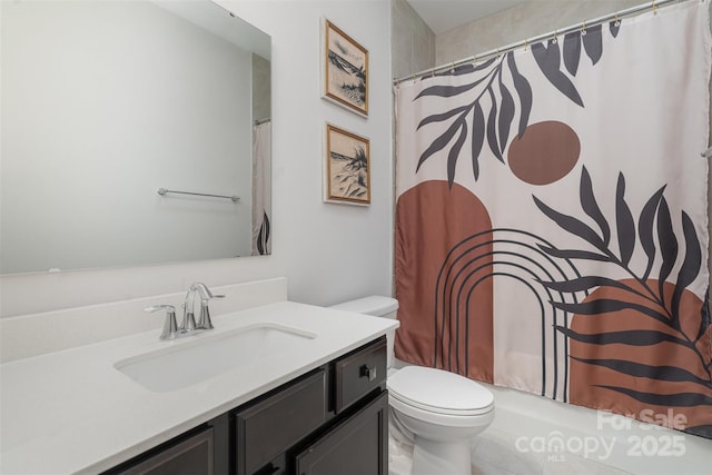 bathroom with vanity and toilet