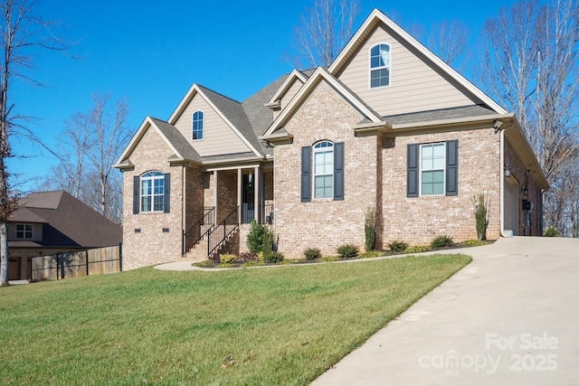 view of front of house featuring a front lawn and a garage