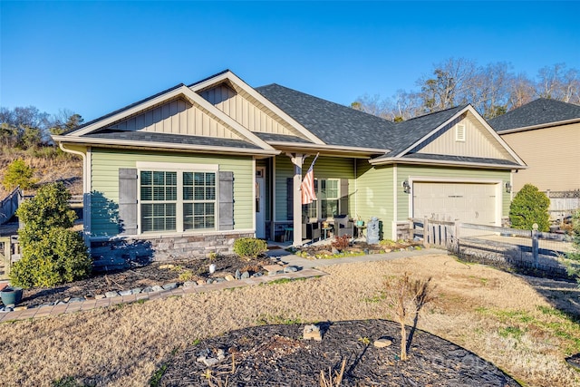 craftsman-style home featuring a porch and a garage