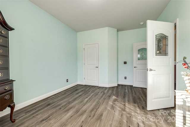 unfurnished bedroom featuring dark wood-type flooring