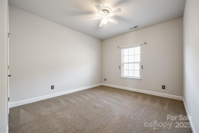 carpeted empty room featuring ceiling fan