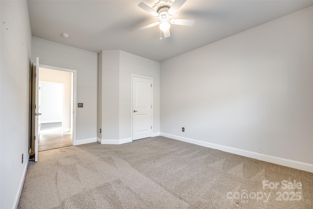 unfurnished bedroom with ceiling fan and carpet