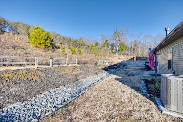 view of yard with central AC