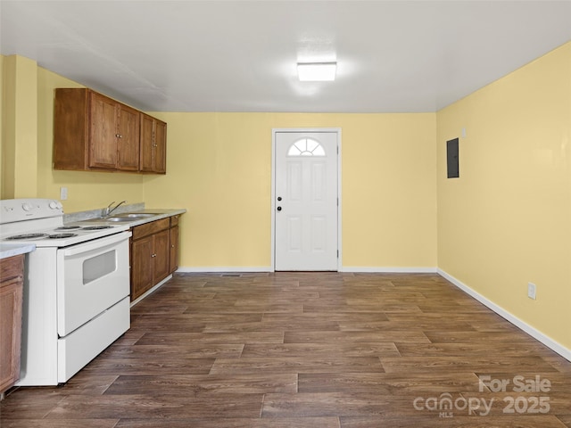 kitchen with dark wood-type flooring, sink, and white electric range