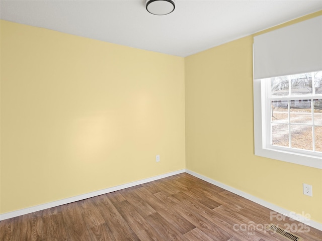 unfurnished room featuring wood-type flooring