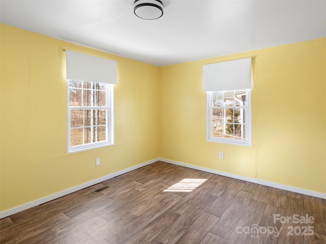 empty room featuring hardwood / wood-style floors