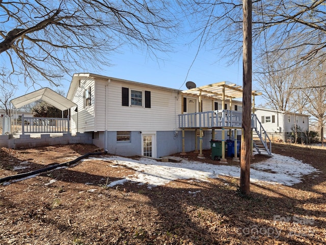 back of property with a wooden deck and a pergola