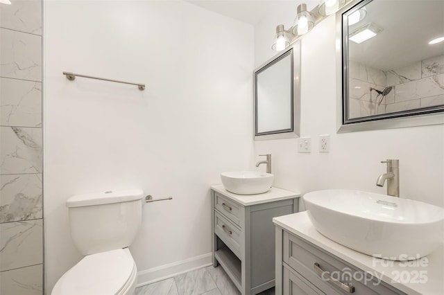 bathroom with a shower, toilet, and vanity