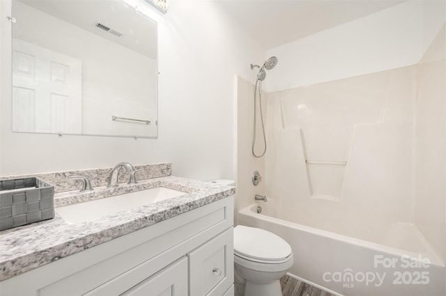 full bathroom with tub / shower combination, toilet, and vanity