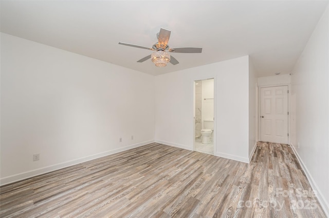 spare room with ceiling fan and light hardwood / wood-style flooring