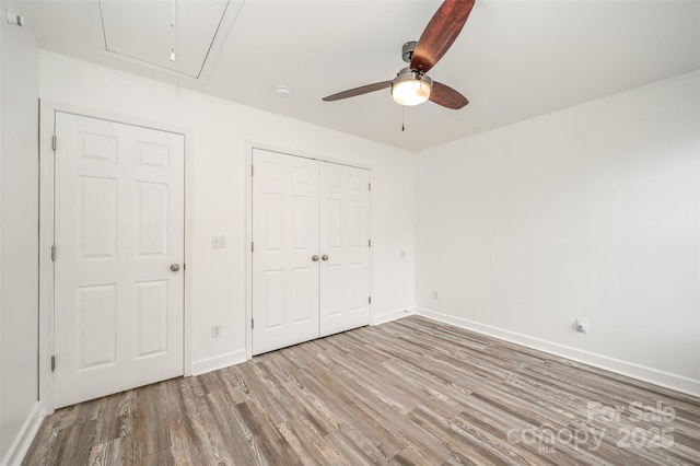 unfurnished bedroom featuring ceiling fan and light hardwood / wood-style floors