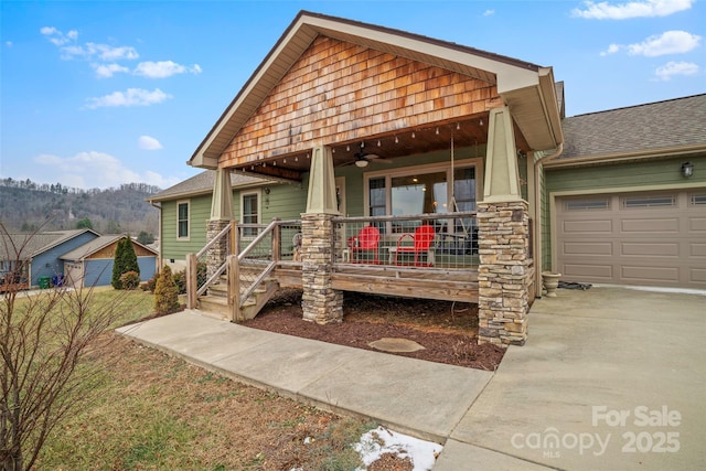 view of front facade with a garage and a porch