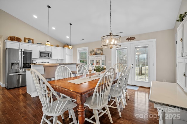 dining room with french doors, dark hardwood / wood-style flooring, and high vaulted ceiling