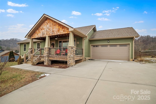 view of front of home with a porch and a garage