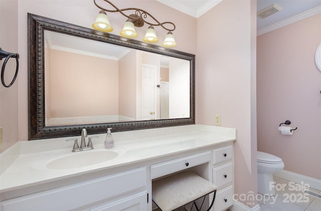 bathroom with vanity, crown molding, tile patterned floors, and toilet