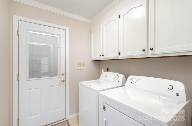 clothes washing area featuring cabinets, ornamental molding, and separate washer and dryer