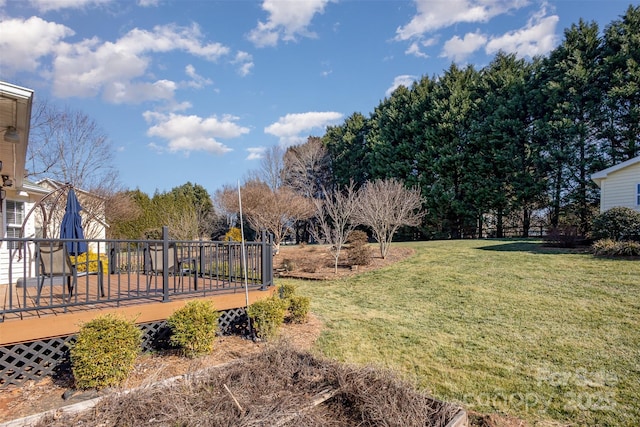 view of yard with a wooden deck