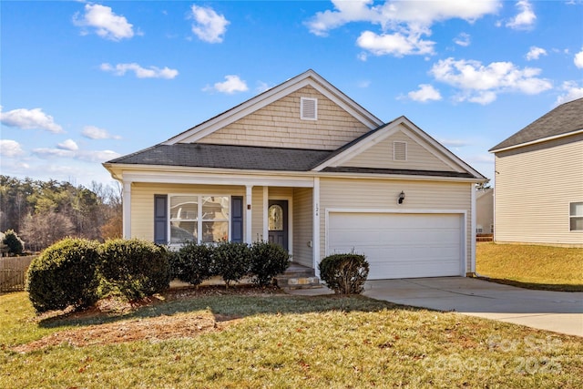 view of front of property with a garage and a front yard