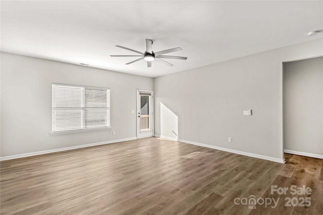 empty room featuring ceiling fan and wood-type flooring