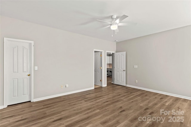 unfurnished bedroom with ceiling fan and dark hardwood / wood-style floors