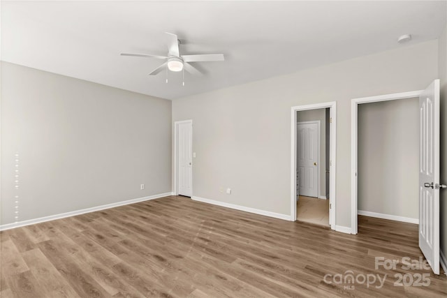 unfurnished bedroom featuring hardwood / wood-style floors and ceiling fan